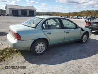 1997 Saturn SL with VIN 1G8ZK5274VZ271990, listed as a Copart auction lot 87279155 with 147,825 mi miles and Salvage title. Bid and sale history available at DreamBid. Image 3.
