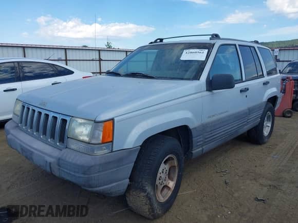 1996 Jeep Grand Cherokee Laredo z VIN 1J4GZ58S9TC245352, wystawiony jako IAAI lot #42860561 z przebiegiem Nie podano mil oraz . Historia ofert i sprzedaży dostępna na DreamBid. Obrazek 2.