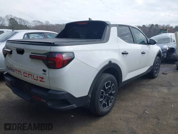 2023 Hyundai Santa Cruz SE with VIN 5NTJADAE4PH072174, listed as a IAAI auction lot 41833752 with 111,424 mi miles and . Bid and sale history available at DreamBid. Image 4.