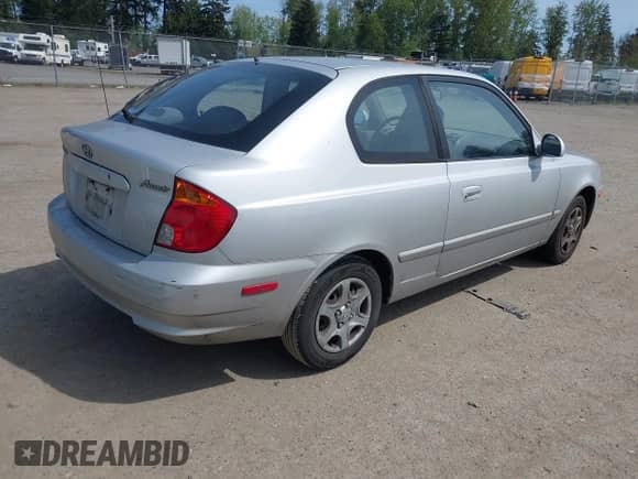 2005 Hyundai Accent GLS z VIN KMHCG35C65U332999, wystawiony jako IAAI lot #42097932 z przebiegiem 225 593 mil mil oraz . Historia ofert i sprzedaży dostępna na DreamBid. Obrazek 4.