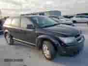 2014 Dodge Journey American Value with VIN 3C4PDCAB1ET283961, listed as a Copart auction lot 65348255 with 200,998 mi miles and Salvage title. Bid and sale history available at DreamBid. Image 4.