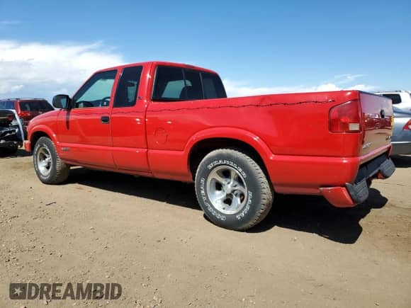 2003 Chevrolet S-10 LS with VIN 1GCCS19X038191048, listed as a Copart auction lot 80164935 with 103,558 mi miles and Salvage title. Bid and sale history available at DreamBid. Image 2.