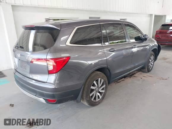 2021 Honda Pilot EX-L z VIN 5FNYF5H53MB030907, wystawiony jako IAAI lot #42454010 z przebiegiem 153 125 mil mil oraz . Historia ofert i sprzedaży dostępna na DreamBid. Obrazek 4.