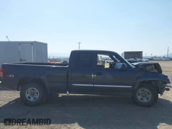 2003 GMC Sierra 1500 SLT z VIN 1GTEK19T03E191705, wystawiony jako IAAI lot #42145392 z przebiegiem Nie podano mil oraz . Historia ofert i sprzedaży dostępna na DreamBid. Obrazek 14.