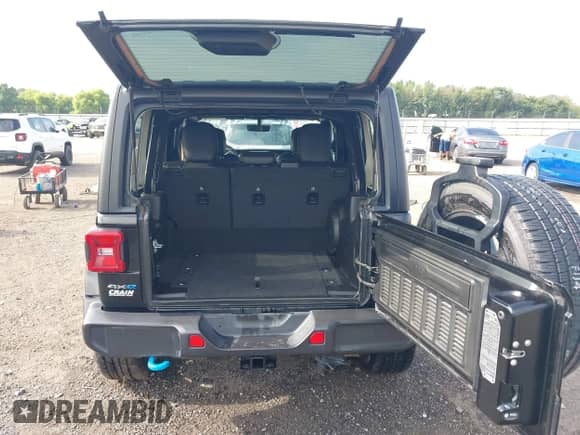 2023 Jeep Wrangler Sahara with VIN 1C4JJXP62PW628735, listed as a IAAI auction lot 42683940 with 46,534 mi miles and . Bid and sale history available at DreamBid. Image 17.