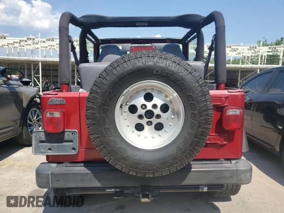 1998 Jeep Wrangler Sport z VIN 1J4FY19S9WP761133, wystawiony jako Copart lot #65012245 z przebiegiem 200 759 mil mil oraz Szkoda całkowita • Salvage title. Historia ofert i sprzedaży dostępna na DreamBid. Obrazek 6.