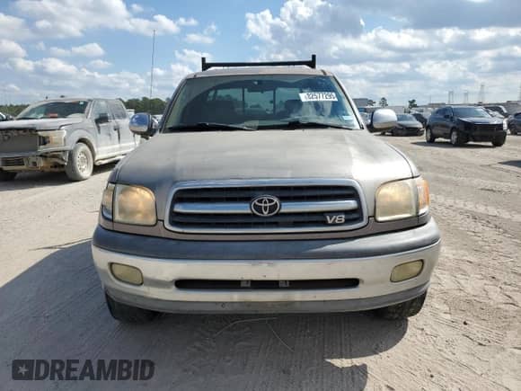 2002 Toyota Tundra SR5 z VIN 5TBRT34132S295977, wystawiony jako Copart lot #82577295 z przebiegiem 218 368 mil mil oraz Czysty tytuł • Clean title. Historia ofert i sprzedaży dostępna na DreamBid. Obrazek 5.
