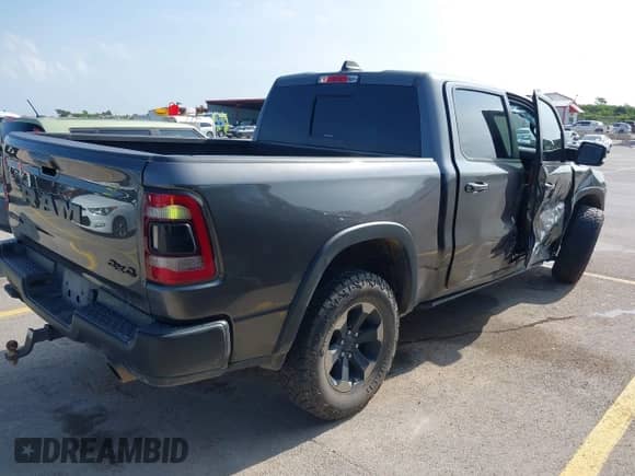 2019 Ram 1500 Rebel z VIN 1C6SRFLT4KN698648, wystawiony jako IAAI lot #42506713 z przebiegiem 143 425 mil mil oraz . Historia ofert i sprzedaży dostępna na DreamBid. Obrazek 4.