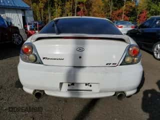 2003 Hyundai Tiburon GT с VIN KMHHN65FX3U096958, выставлен на аукционе Copart как лот 75451144 с пробегом 200 579 миль миль и Списание • Salvage title. История ставок и продаж доступна на DreamBid. Изображение 6.