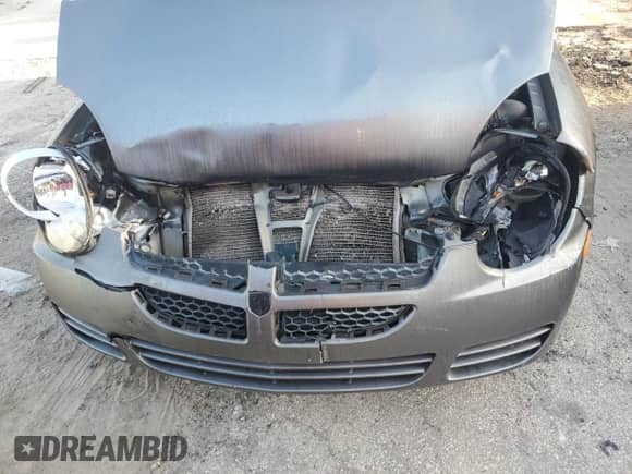 2005 Dodge Neon SXT z VIN 1B3ES56C85D280573, wystawiony jako Copart lot #84171994 z przebiegiem 93 469 mil mil oraz Szkoda całkowita • Salvage title. Historia ofert i sprzedaży dostępna na DreamBid. Obrazek 13.