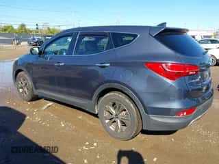 2015 Hyundai Santa Fe z VIN 5XYZTDLB1FG244312, wystawiony jako IAAI lot #43469595 z przebiegiem 108 143 mil mil oraz . Historia ofert i sprzedaży dostępna na DreamBid. Obrazek 3.