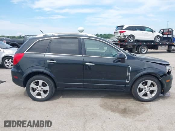2014 Chevrolet Captiva Sport LTZ z VIN 3GNAL4EK2ES630641, wystawiony jako IAAI lot #42646081 z przebiegiem 154 830 mil mil oraz . Historia ofert i sprzedaży dostępna na DreamBid. Obrazek 13.