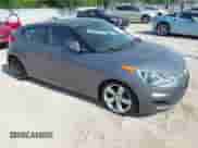 2013 Hyundai Veloster w/Gray Int z VIN KMHTC6AD9DU128725, wystawiony jako IAAI lot #42648356 z przebiegiem 168 109 mil mil oraz . Historia ofert i sprzedaży dostępna na DreamBid. Obrazek 1.