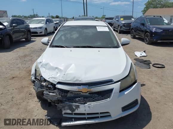 2014 Chevrolet Cruze 1LT z VIN 1G1PC5SB7E7166217, wystawiony jako IAAI lot #41839197 z przebiegiem 133 436 mil mil oraz . Historia ofert i sprzedaży dostępna na DreamBid. Obrazek 12.