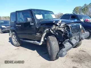 2012 Jeep Wrangler Sahara with VIN 1C4GJWBGXCL104006, listed as a IAAI auction lot 41470054 with 148,472 mi miles and . Bid and sale history available at DreamBid. Image 1.