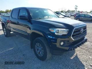 2016 Toyota Tacoma TRD Sport z VIN 3TMDZ5BN6GM009385, wystawiony jako IAAI lot #43024382 z przebiegiem 128 855 mil mil oraz . Historia ofert i sprzedaży dostępna na DreamBid. Obrazek 1.