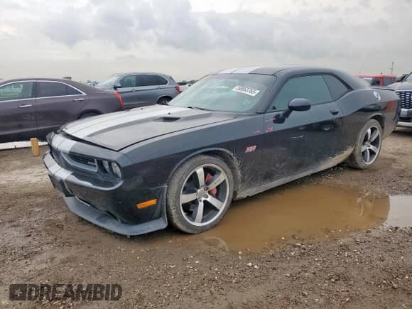 2012 Dodge Challenger SRT-8 392 с VIN 2C3CDYCJ9CH227972, выставлен на аукционе Copart как лот 58953765 с пробегом 69 004 миль миль и Списание • Salvage title. История ставок и продаж доступна на DreamBid. Изображение 1.