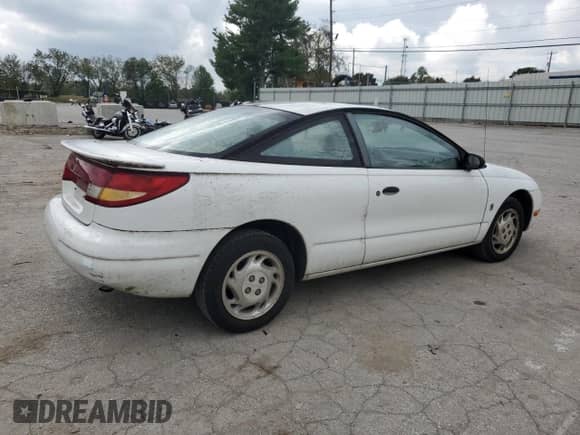 1997 Saturn SC with VIN 1G8ZF1282VZ133256, listed as a Copart auction lot 74026354 with 84,564 mi miles and Salvage title. Bid and sale history available at DreamBid. Image 3.