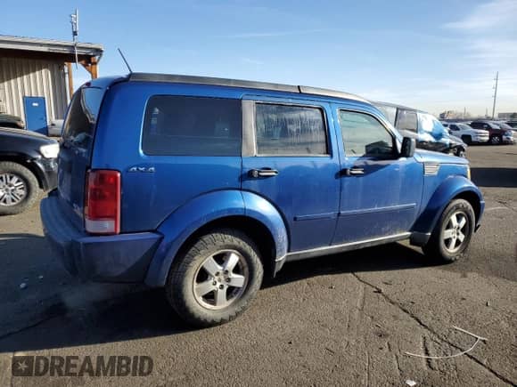 2009 Dodge Nitro SE with VIN 1D8GU28K19W528128, listed as a Copart auction lot 48817735 with 143,417 mi miles and Salvage title. Bid and sale history available at DreamBid. Image 3.