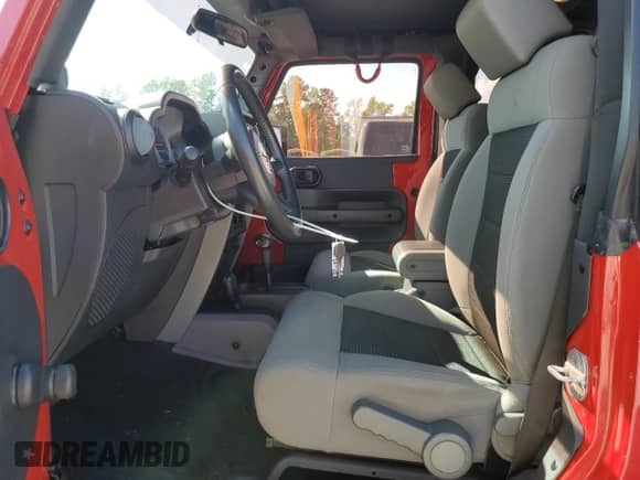 2010 Jeep Wrangler Sport with VIN 1J4AA2D13AL230819, listed as a Copart auction lot 81859015 with 104,290 mi miles and Salvage title. Bid and sale history available at DreamBid. Image 7.