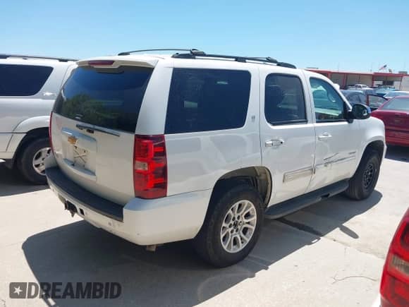 2014 Chevrolet Tahoe LT with VIN 1GNSCBE03ER213054, listed as a IAAI auction lot 42821489 with 166,689 mi miles and . Bid and sale history available at DreamBid. Image 4.