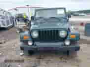 1999 Jeep Wrangler Sahara z VIN 1J4FY49S5XP482037, wystawiony jako IAAI lot #42341723 z przebiegiem 161 081 mil mil oraz . Historia ofert i sprzedaży dostępna na DreamBid. Obrazek 13.