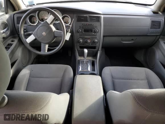 2005 Dodge Magnum SXT с VIN 2D4GZ48VX5H644848, выставлен на аукционе Copart как лот 87614515 с пробегом 146 577 миль миль и На запчасти • Non repairable. История ставок и продаж доступна на DreamBid. Изображение 8.