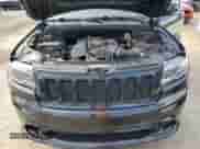 2012 Jeep Grand Cherokee SRT-8 z VIN 1C4RJFDJ7CC100156, wystawiony jako Copart lot #79865954 z przebiegiem 113 782 mil mil oraz Szkoda całkowita • Salvage title. Historia ofert i sprzedaży dostępna na DreamBid. Obrazek 12.