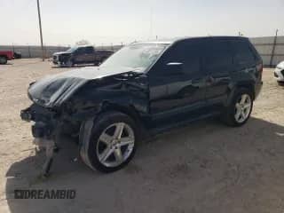 2005 Jeep Grand Cherokee Laredo with VIN 1J4HS48N35C706657, listed as a Copart auction lot 43011235 with 337,485 mi miles and Salvage title. Bid and sale history available at DreamBid. Image 1.