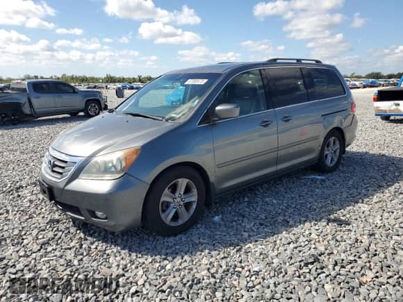 2009 Honda Odyssey Touring z VIN 5FNRL38999B059288, wystawiony jako Copart lot #87080475 z przebiegiem 256 763 mil mil oraz Czysty tytuł • Clean title. Historia ofert i sprzedaży dostępna na DreamBid. Obrazek 1.