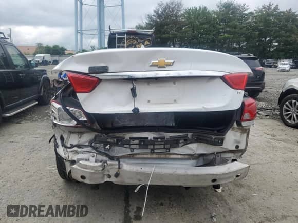 2014 Chevrolet Impala LT z VIN 2G1125S35E9103875, wystawiony jako Copart lot #63857705 z przebiegiem Nie podano mil oraz Szkoda całkowita • Salvage title. Historia ofert i sprzedaży dostępna na DreamBid. Obrazek 6.