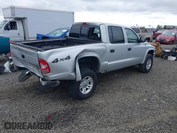 2003 Dodge Dakota SLT с VIN 1D7HG48N63S185093, выставлен на аукционе IAAI как лот 42338789 с пробегом 132 389 миль миль и . История ставок и продаж доступна на DreamBid. Изображение 4.