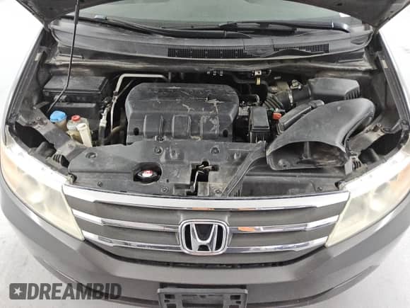 2013 Honda Odyssey EX-L z VIN 5FNRL5H68DB084399, wystawiony jako Copart lot #71293185 z przebiegiem 210 097 mil mil oraz Czysty tytuł • Clean title. Historia ofert i sprzedaży dostępna na DreamBid. Obrazek 12.