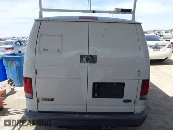 2004 Ford Econoline Cargo with VIN 1FTRE14W44HA29084, listed as a IAAI auction lot 41793350 with 123,429 mi miles and . Bid and sale history available at DreamBid. Image 16.