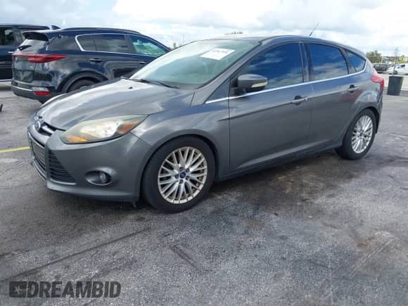 2014 Ford Focus Titanium with VIN 1FADP3N21EL340519, listed as a IAAI auction lot 43367551 with 161,343 mi miles and . Bid and sale history available at DreamBid. Image 2.