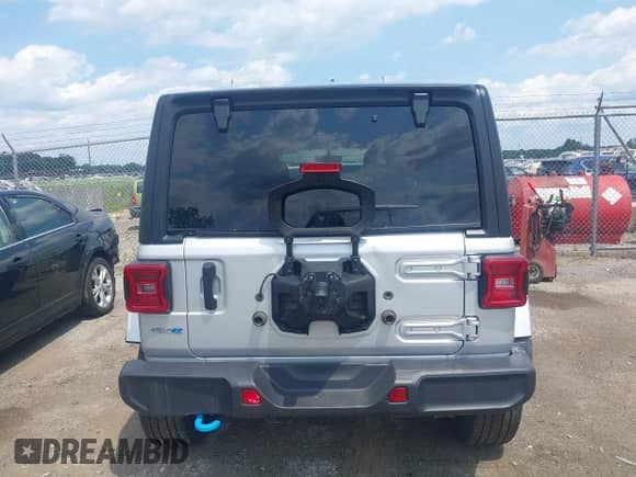 2023 Jeep Wrangler Sahara with VIN 1C4JJXP69PW695915, listed as a IAAI auction lot 42662028 with 36,957 mi miles and . Bid and sale history available at DreamBid. Image 16.