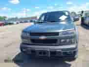 2011 Chevrolet Colorado 1LT z VIN 1GCHTCFE5B8113848, wystawiony jako IAAI lot #42781184 z przebiegiem 64 485 mil mil oraz . Historia ofert i sprzedaży dostępna na DreamBid. Obrazek 12.