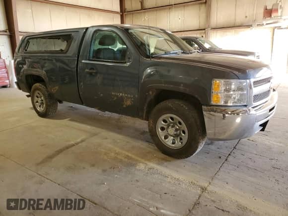 2012 Chevrolet Silverado 1500 Work Truck z VIN 1GCNKPEX6CZ336203, wystawiony jako Copart lot #85278025 z przebiegiem 117 157 mil mil oraz Szkoda całkowita • Salvage title. Historia ofert i sprzedaży dostępna na DreamBid. Obrazek 4.