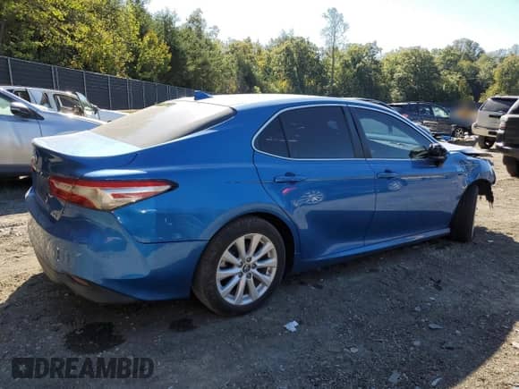 2019 Toyota Camry LE с VIN 4T1B11HK7KU264700, выставлен на аукционе Copart как лот 85474625 с пробегом 128 420 миль миль и Списание • Salvage title. История ставок и продаж доступна на DreamBid. Изображение 3.