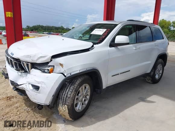 2020 Jeep Grand Cherokee Laredo E with VIN 1C4RJEAG5LC392277, listed as a IAAI auction lot 43310642 with 34,267 mi miles and . Bid and sale history available at DreamBid. Image 17.