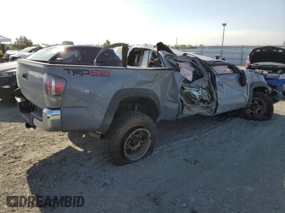 2020 Toyota Tacoma SR5 z VIN 3TMDZ5BN9LM097293, wystawiony jako Copart lot #70841275 z przebiegiem Nie podano mil oraz Nie do naprawy • Non repairable. Historia ofert i sprzedaży dostępna na DreamBid. Obrazek 3.