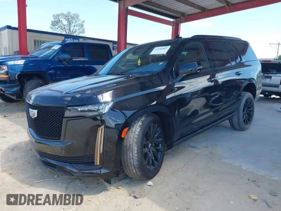 2021 Cadillac Escalade Sport z VIN 1GYS3FKL3MR216155, wystawiony jako IAAI lot #42049587 z przebiegiem 84 000 mil mil oraz . Historia ofert i sprzedaży dostępna na DreamBid. Obrazek 2.