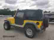 2000 Jeep Wrangler SE with VIN 1J4FA29P0YP775110, listed as a Copart auction lot 71498795 with 72,782 mi miles and Clean title. Bid and sale history available at DreamBid. Image 2.