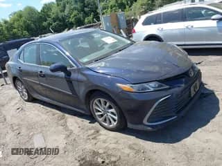 2021 Toyota Camry LE with VIN 4T1C11AK7MU516429, listed as a IAAI auction lot 42794424 with 52,924 mi miles and . Bid and sale history available at DreamBid. Image 1.