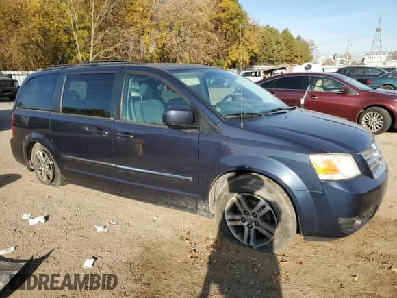 2009 Dodge Caravan with VIN 2D8HN44X39R672674, listed as a Copart auction lot 73094654 with 205,972 mi miles and Salvage title. Bid and sale history available at DreamBid. Image 4.