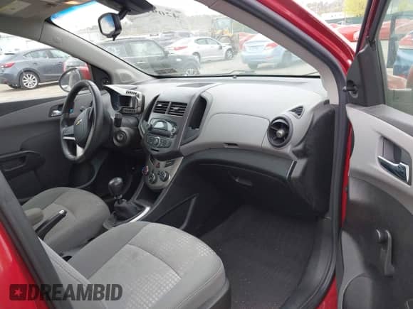 2012 Chevrolet Sonic LS with VIN 1G1JB6SHXC4114498, listed as a IAAI auction lot 42091500 with 128,638 mi miles and . Bid and sale history available at DreamBid. Image 5.