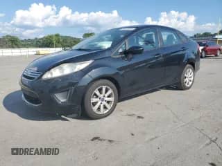 2012 Ford Fiesta SE with VIN 3FADP4BJ7CM155713, listed as a Copart auction lot 69510645 with 94,395 mi miles and Salvage title. Bid and sale history available at DreamBid. Image 1.
