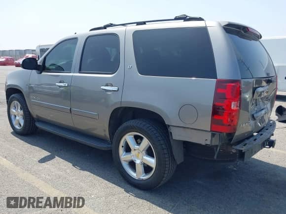 2007 Chevrolet Tahoe LT with VIN 1GNFC13J97R274323, listed as a IAAI auction lot 42454296 with 157,470 mi miles and . Bid and sale history available at DreamBid. Image 3.