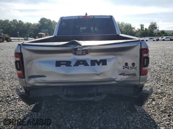 2020 Ram 1500 Rebel z VIN 1C6SRFLT7LN199084, wystawiony jako Copart lot #64990655 z przebiegiem 143 021 mil mil oraz Nie do naprawy • Non repairable. Historia ofert i sprzedaży dostępna na DreamBid. Obrazek 6.
