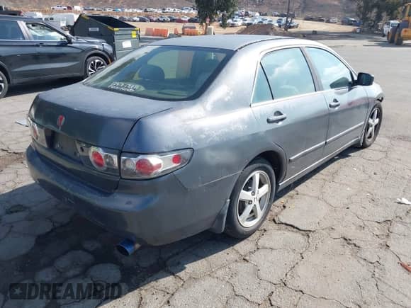 2003 Honda Accord LX with VIN JHMCM56343C066830, listed as a IAAI auction lot 43464871 with 219,179 mi miles and . Bid and sale history available at DreamBid. Image 4.